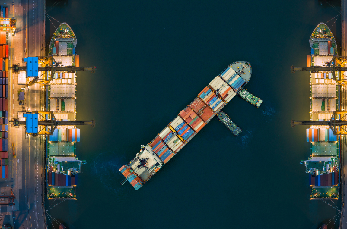 Cargo ship at a busy shipping port with numerous containers, representing customs delays solutions.