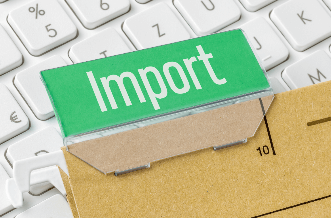 A folder labeled 'Import' on a computer keyboard, symbolizing organized import procedures.